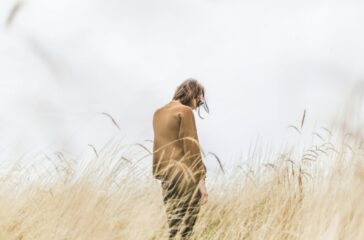 person-standing-in-the-middle-of-wheat-field-kq3MXXDGeOM