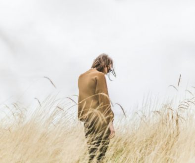 person-standing-in-the-middle-of-wheat-field-kq3MXXDGeOM