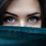 a-close-up-of-a-person-with-blue-eyes-4bmtMXGuVqo