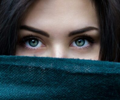 a-close-up-of-a-person-with-blue-eyes-4bmtMXGuVqo