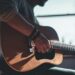 man-playing-acoustic-guitar-selective-focus-photography-hUHzaiAHuUc