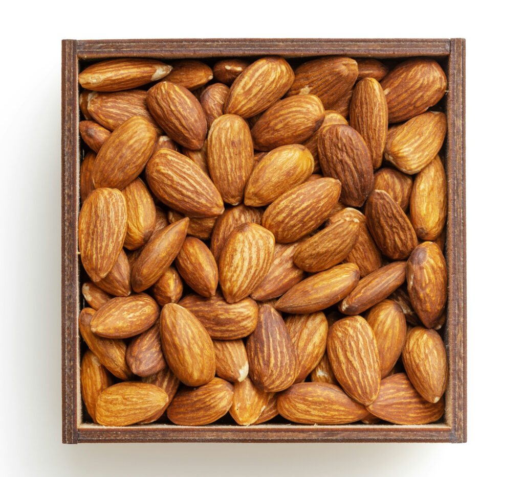 rown-almond-nuts-on-white-surface-y6PeMgIa2Xo