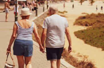 man-and-woman-walking-on-road-while-holding-hands-DLLpNmIG0pk