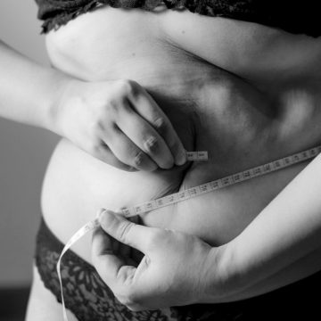 https://unsplash.com/photos/grayscale-photo-of-woman-holding-her-breast-Fu7RNjl-pW0