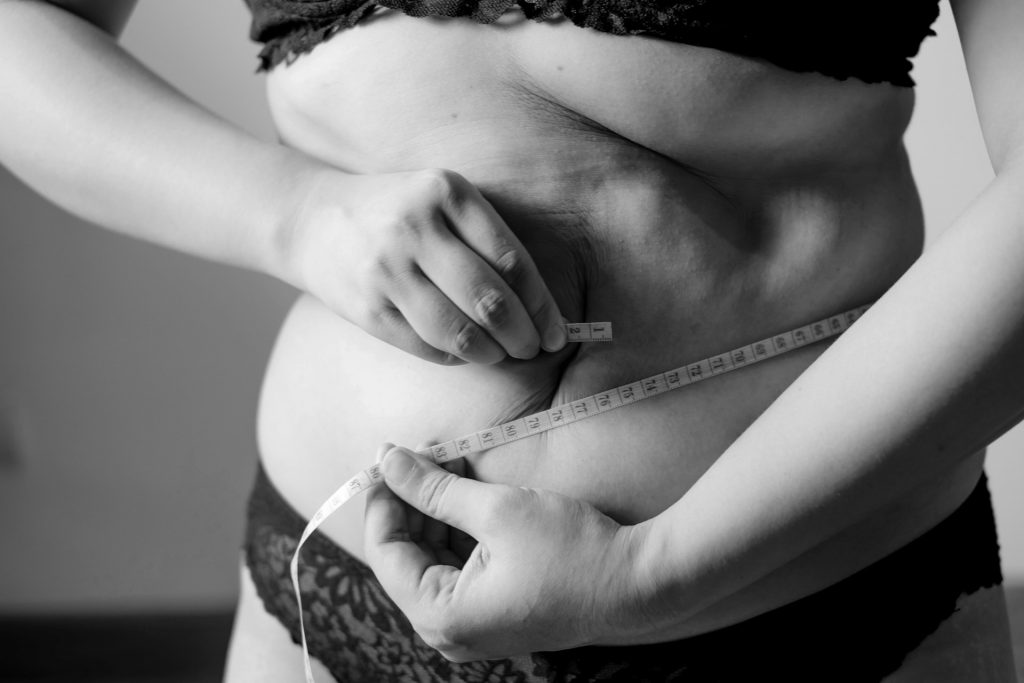 https://unsplash.com/photos/grayscale-photo-of-woman-holding-her-breast-Fu7RNjl-pW0
