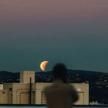 person-standing-during-nighttime-with-crescent-moon-PZXq_fY2hyI