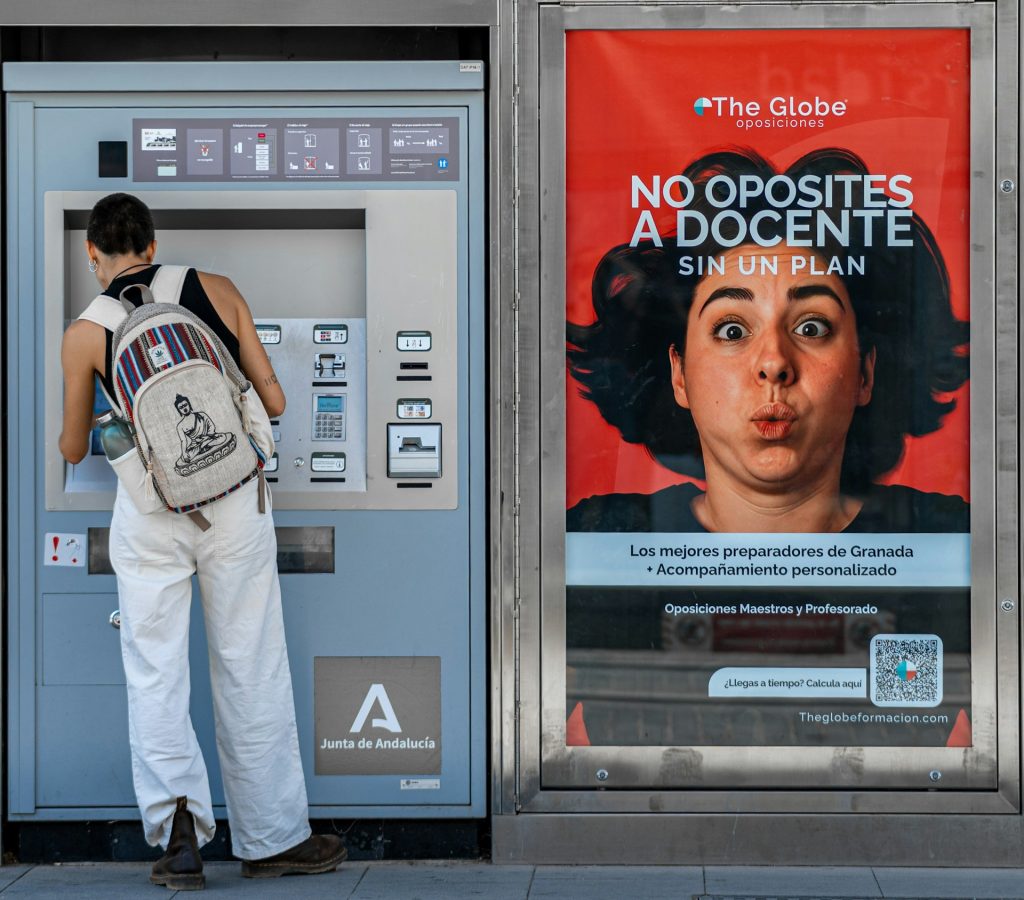https://unsplash.com/photos/woman-using-ticket-machine-next-to-advertisement-8mVn4zF6BHM