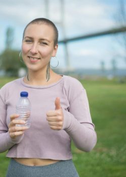 smiling-woman-showing-her-thumbs-up-sign-8713837/