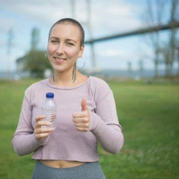 smiling-woman-showing-her-thumbs-up-sign-8713837/