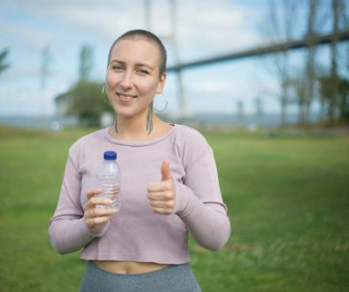 smiling-woman-showing-her-thumbs-up-sign-8713837/