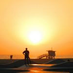 people-standing-on-a-beach-during-sunset-14214301/