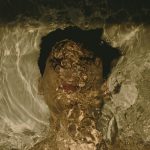 a-man-swimming-in-a-pool-of-water-2ZQGImk47yA