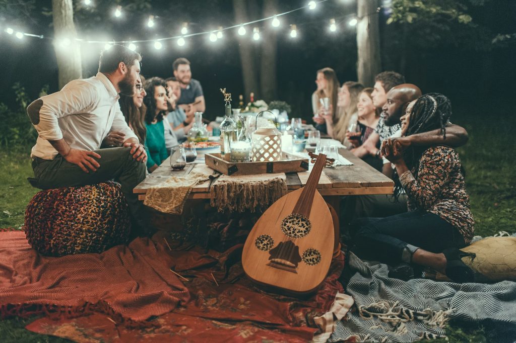 people-sitting-on-chair-in-front-of-table-with-candles-and-candles-UrzN-8K1PCE